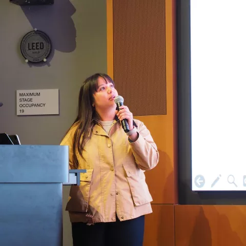 Scholar presenting science on stage